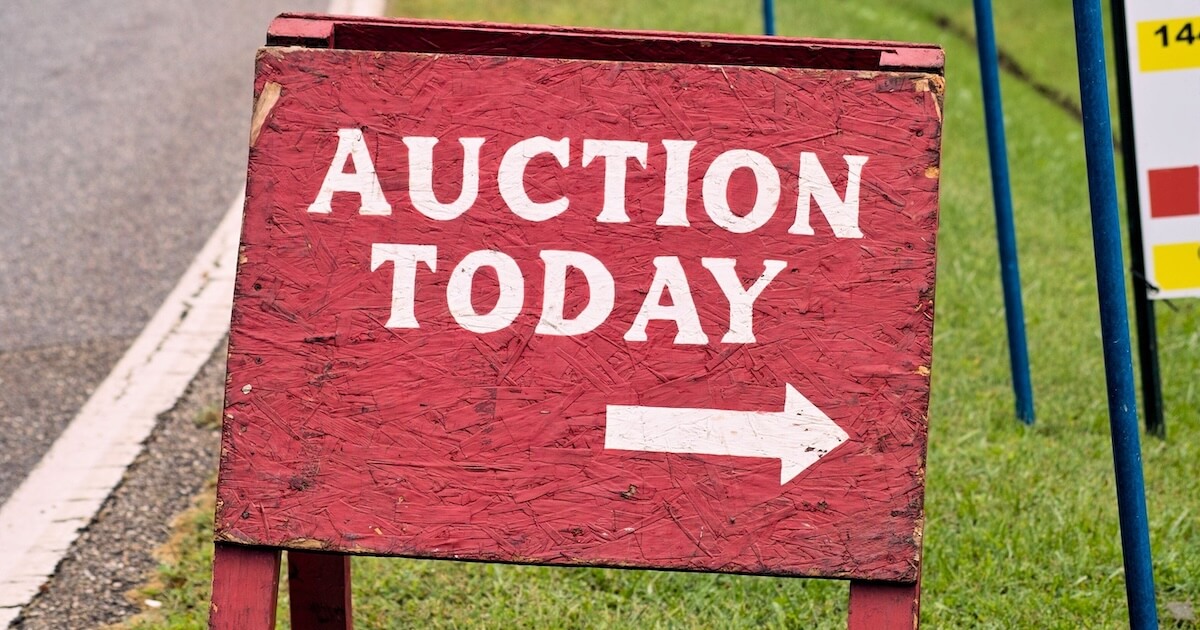 Sign that reads Auction Today representing how to bid with Google Ad Grants ads