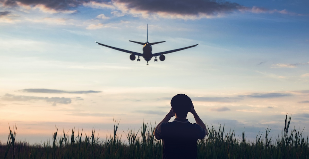 Person watches a plane land - a landing page that needs to be optimized for Google Ads