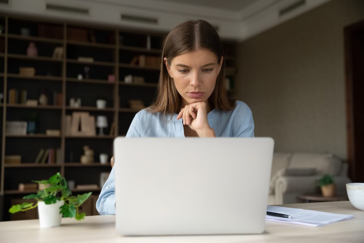 email marketing for schools - woman composes a newsletter